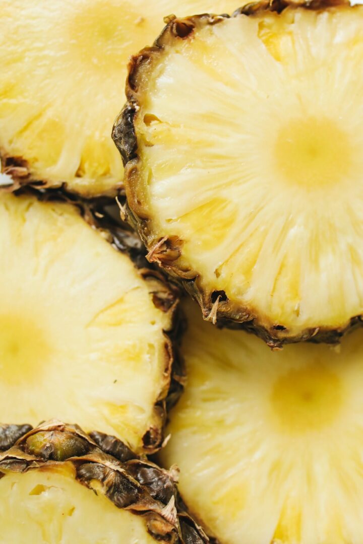 Close-up of freshly sliced pineapple rings showing juicy texture.