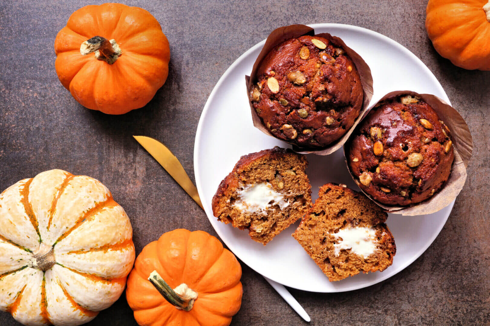 Pumpkin muffins with butter and mini pumpkins