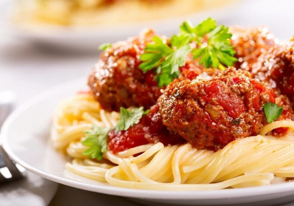 Close-up meatballs over spaghetti with sauce